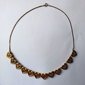Vintage 1985 Franklin mint sterling with gold vermeil 12 heart charm necklace
